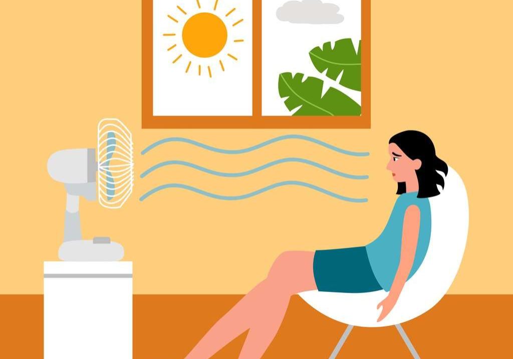 Woman sitting in a Seattle home with the sun streaming in and in need of energy saving tips from Exact Electric.