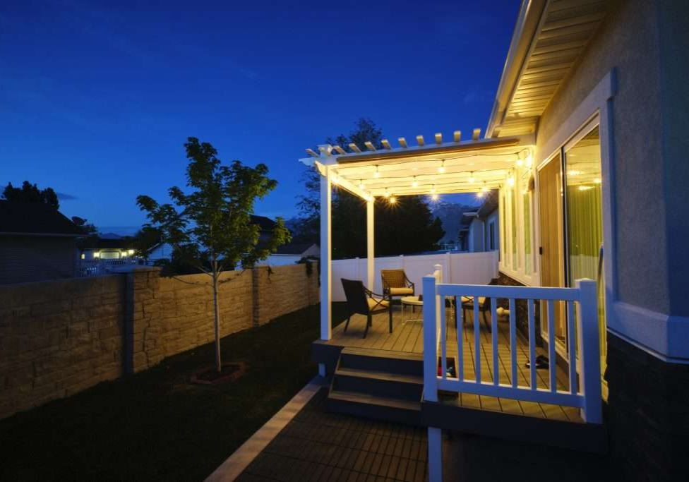 Exterior Seattle home with outdoor living space lit up with the help of a Seattle Electrician.