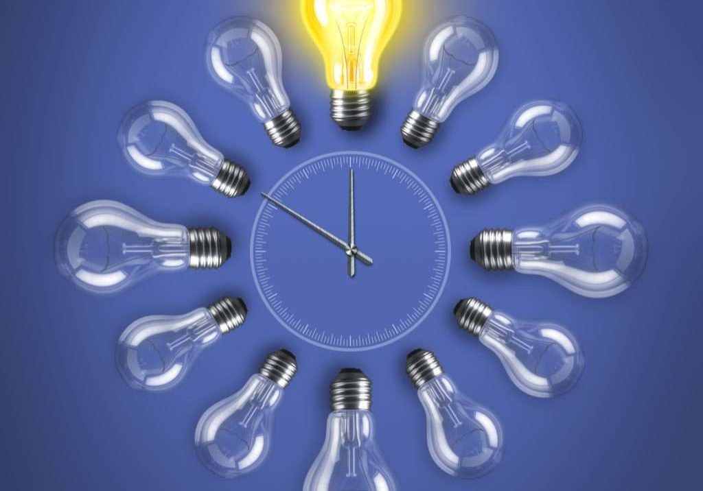Group of lamp bulbs clock on blue background. 3D illustration